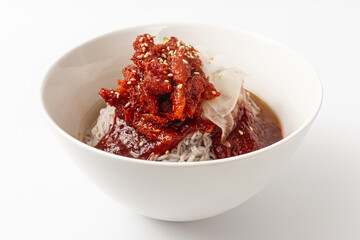 Semi-dry seasoning Alaska pollock Naengmyeon on white background