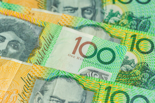 Green australian one hundred dollar notes in cash
