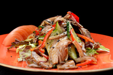 Salad with meat, fresh vegetables and sesame