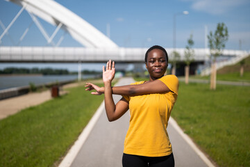 Young woman enjoys exercising outdoor.	