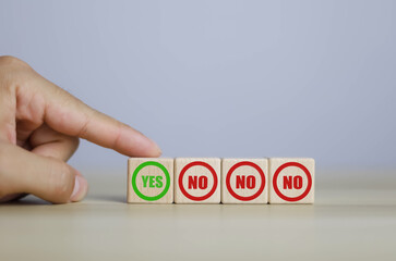 wooden block yes or no symbol and checkmark  Alternative concepts, decision making, and true and...