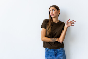 Arrogant woman shrugging raise hands look with disdain and confusion with strange accusation on white background