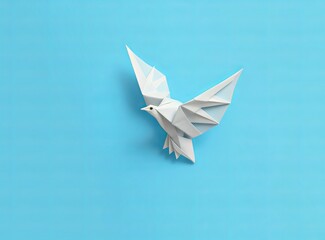 paper white dove on a bright blue background