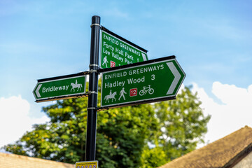 Pedestrian signs along the London Loop 17 in Enfield. Shot on 22 June 2023.