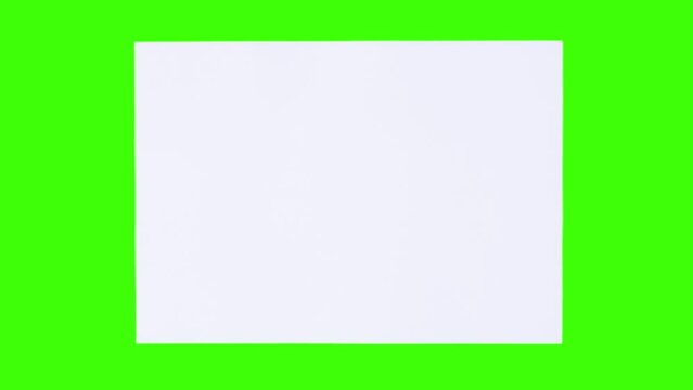 Sheets of A4 paper appear on a green screen
