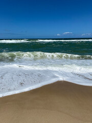 Fototapeta na wymiar BLUE SEA, CRYSTAL CLEAR WATER, BEACH AND BLUE SKY.