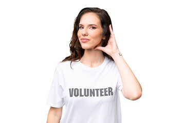 Young volunteer caucasian woman over isolated background having doubts
