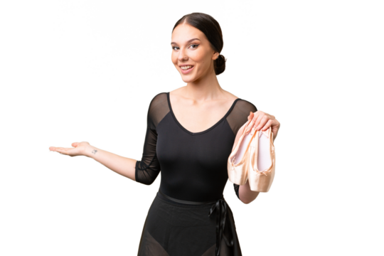 Young caucasian woman practicing ballet over isolated background extending hands to the side for inviting to come