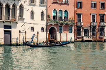 Fototapeta na wymiar Idyllic Gondolas Gliding Along Venice's Grand Canal