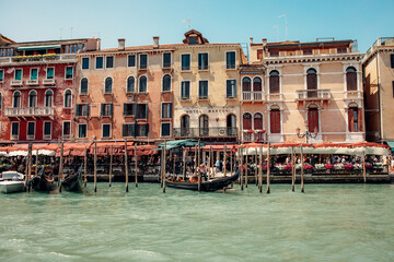 Venice's Canal-Side Buildings with Gondola Stations