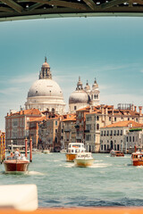 Fototapeta na wymiar Iconic and Picturesque Spot on Venice's Grand Canal with Boats