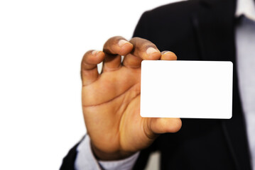 close up of business man in suit holding blank id card over white background 