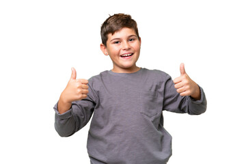 Little caucasian kid over isolated chroma key background giving a thumbs up gesture