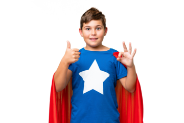 Super Hero caucasian kid over isolated chroma key background showing ok sign and thumb up gesture