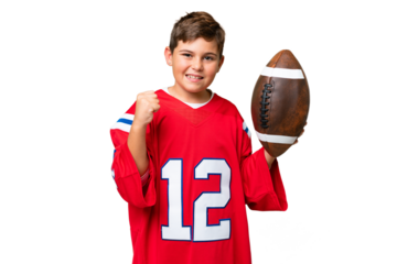 Little caucasian kid playing rugby over isolated chroma key background celebrating a victory