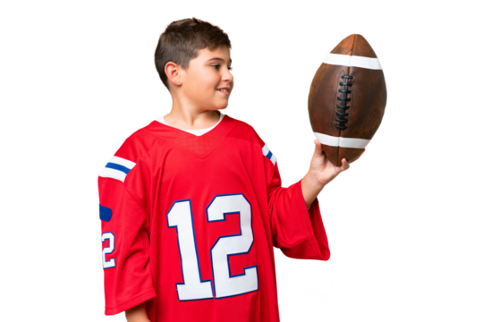 Little caucasian kid playing rugby over isolated chroma key background with happy expression