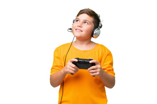 Little caucasian kid playing with a video game controller over isolated chroma key background thinking an idea while looking up