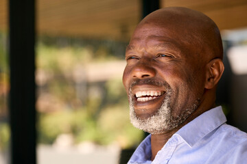 Fototapeta premium Portrait Of Smiling Senior Man Standing Outdoors In Garden Park Or Countryside