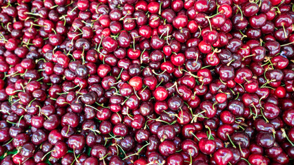 large amount of vivid cherries on sale at the market