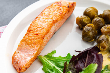 salmon and Brussels sprouts second course healthy meal food snack on the table copy space food background rustic top view keto or paleo diet