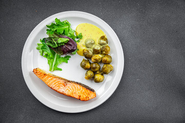 salmon and Brussels sprouts second course healthy meal food snack on the table copy space food...