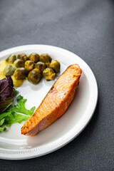salmon and Brussels sprouts second course healthy meal food snack on the table copy space food background rustic top view keto or paleo diet
