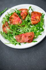 salad tomato arugula healthy meal food snack on the table copy space food background rustic top view keto or paleo diet veggie vegan or vegetarian food