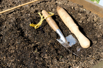 Gardening tools laid onto soil