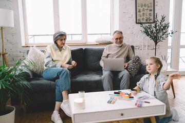 Fototapeta premium Grandparents spending time with grandchild