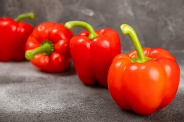 Fresh colorful red bell pepper on marble background. Bell pepper. Vegetables. Vegan food. Healthy foods. Place for text. Place to copy. Diet concept.