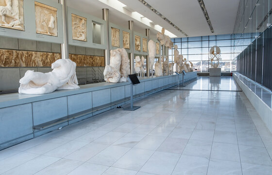 Interior of The Acropolis Museum Displaying Various Original Marble Statues or Sculptures from the Acropolis and the Decorative Top of the Parthenon on May 26, 2023 in Athens, Greece