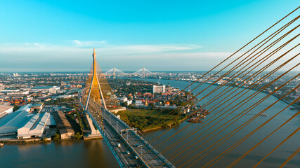 Fototapeta na wymiar Bridge view from the top view of the drone Thailand, Car transport bridge, and river landscapes bird's eye view during sunset