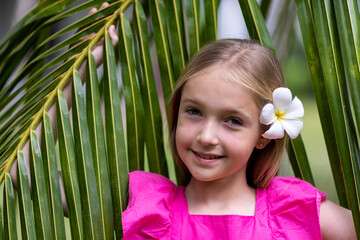 Candid lifestyle portrait of cute little Caucasian girl nine years old with blonde hair in stylish...