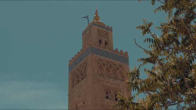 A close up view of Koutoubia Mosque in Marrakech, Morocco during Adan time ( call to prayer )