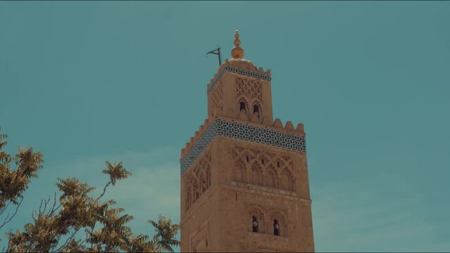 A close up view of Koutoubia Mosque in Marrakech, Morocco during Adan time ( call to prayer )