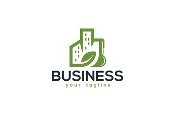 Creative logo design designated to a construction company. This logo design depicts an excavator shaped like a city with a green leaf on the side. 