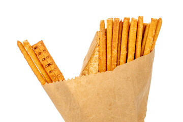 Straw is a bakery product. Several straws in a paper bag isolated on a white background