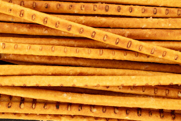 Straw is a bakery product. A few straws, macro, top view.