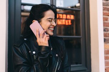 Cheerful woman talking on smartphone