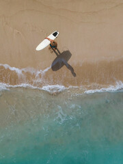 Aerial view of surfer at the beach - 616203288