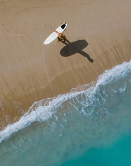 Aerial view of surfer at the beach - 616203456