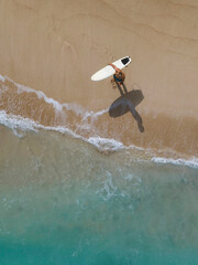 Aerial view of surfer at the beach - 616203824
