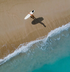 Aerial view of surfer at the beach - 616204088