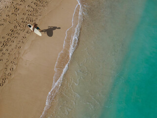 Aerial view of surfer at the beach - 616204412