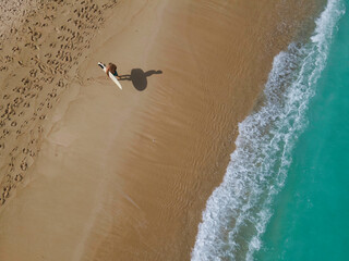 Aerial view of surfer at the beach - 616204870
