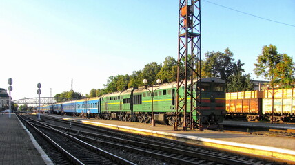 Fototapeta premium The train leaves the station in the evening