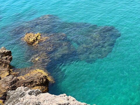 Sea clear water and rocky coast aerial view seascape. 