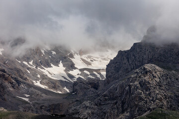 Passing clouds over a landscape in Turkey with snow capped mountains in the background. Landscape of mountain range and mountains.  Dedegol. Turkey.