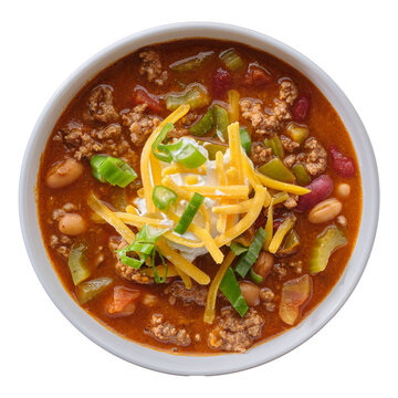 top down photo of beef chili stew in bowl on isolated transparent background with cheese and scallions and sour cream
