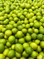 Selling lemons in a market place.this photo was taken from Bangladesh.